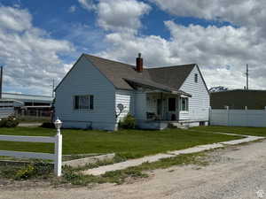 Rear view of house with a lawn