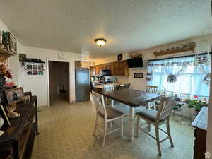 Dining room featuring a textured ceiling