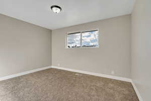 View of carpeted spare room