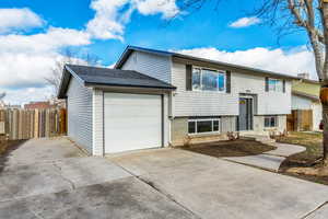 Split foyer home featuring a garage