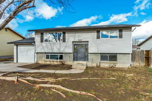 Split foyer home featuring a garage