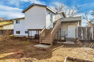 Back of house featuring central AC