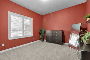 Carpeted bedroom featuring a textured ceiling