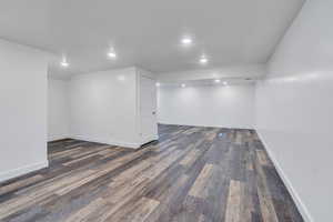 Basement featuring dark hardwood / wood-style flooring