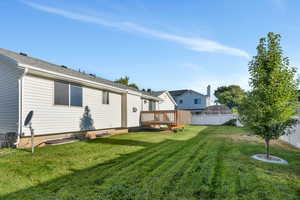 View of yard with a deck