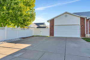 View of property exterior featuring a garage