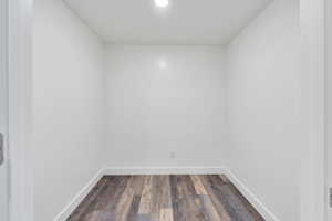 Spare room with dark hardwood / wood-style floors