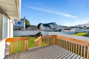 Deck featuring a lawn and a mountain view