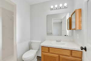 Bathroom featuring vanity and toilet