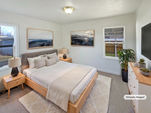 Bedroom with light colored carpet