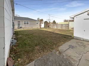 View of yard featuring a storage unit