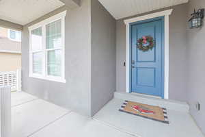 Entrance to property featuring a porch