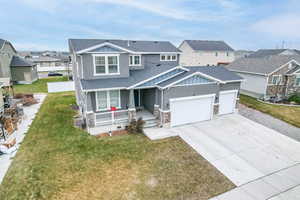 Craftsman-style house featuring a front yard and a porch