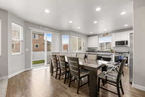 Dining area with light wood-type flooring