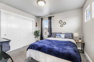 Bedroom with carpet flooring and a closet