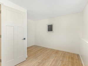 Spare room with light hardwood / wood-style flooring