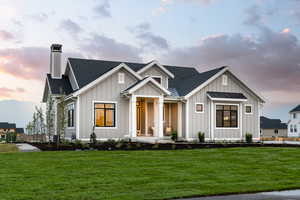 View of front of property featuring a lawn