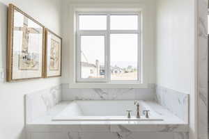 Bathroom with a relaxing tiled tub