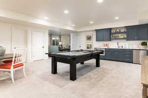 Rec room with light colored carpet, wet bar, and pool table