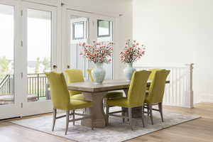 Dining space with light hardwood / wood-style floors