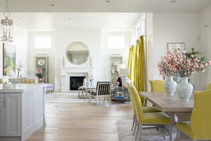 Dining room featuring a high ceiling and light wood-type flooring