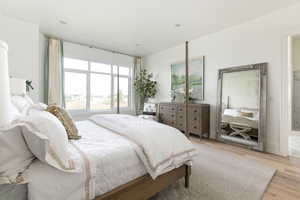 Bedroom with light hardwood / wood-style floors