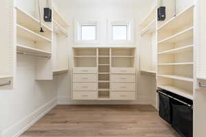 Walk in closet featuring light hardwood / wood-style flooring