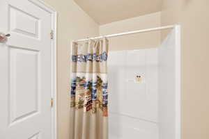 Bathroom with shower / bath combo with shower curtain