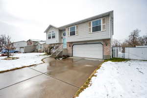 Split foyer home featuring a garage