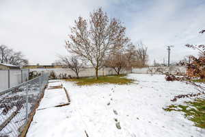 View of yard covered in snow