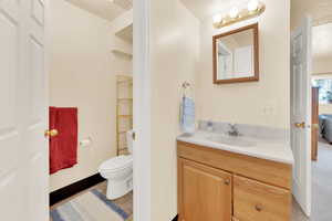 Bathroom featuring vanity and toilet