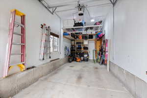 Garage featuring a garage door opener