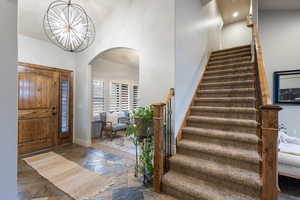 Entryway with a notable chandelier