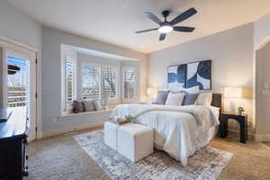 Bedroom featuring access to exterior, ceiling fan, and light carpet