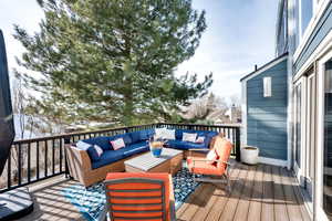 Wooden terrace with an outdoor hangout area