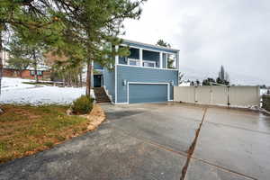 View of front of home featuring a garage