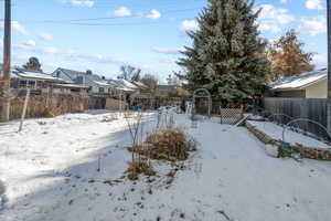 View of yard covered in snow