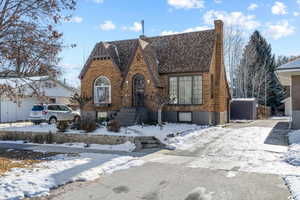 View of front of property featuring a storage unit