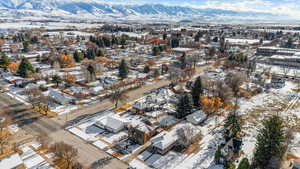 Snowy aerial view featuring a mountain view