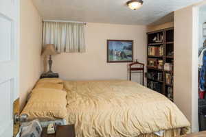 Bedroom featuring a textured ceiling