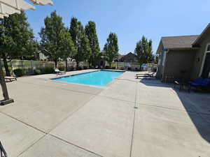 View of swimming pool with a patio