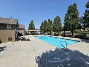 View of pool featuring a patio area