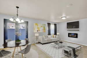 Tiled living room featuring a chandelier