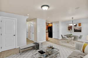 Living room featuring a chandelier