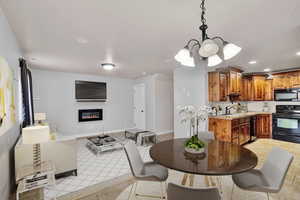 Dining room featuring sink and an inviting chandelier