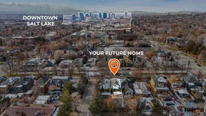 Birds eye view of property featuring a mountain view