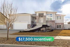 Prairie-style house with a front yard and a garage