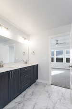 Bathroom with vanity and ceiling fan