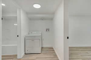 Shared laundry area, accessible from both upstairs and downstairs.