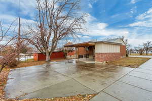 Rear of house with a carport and plenty of parking